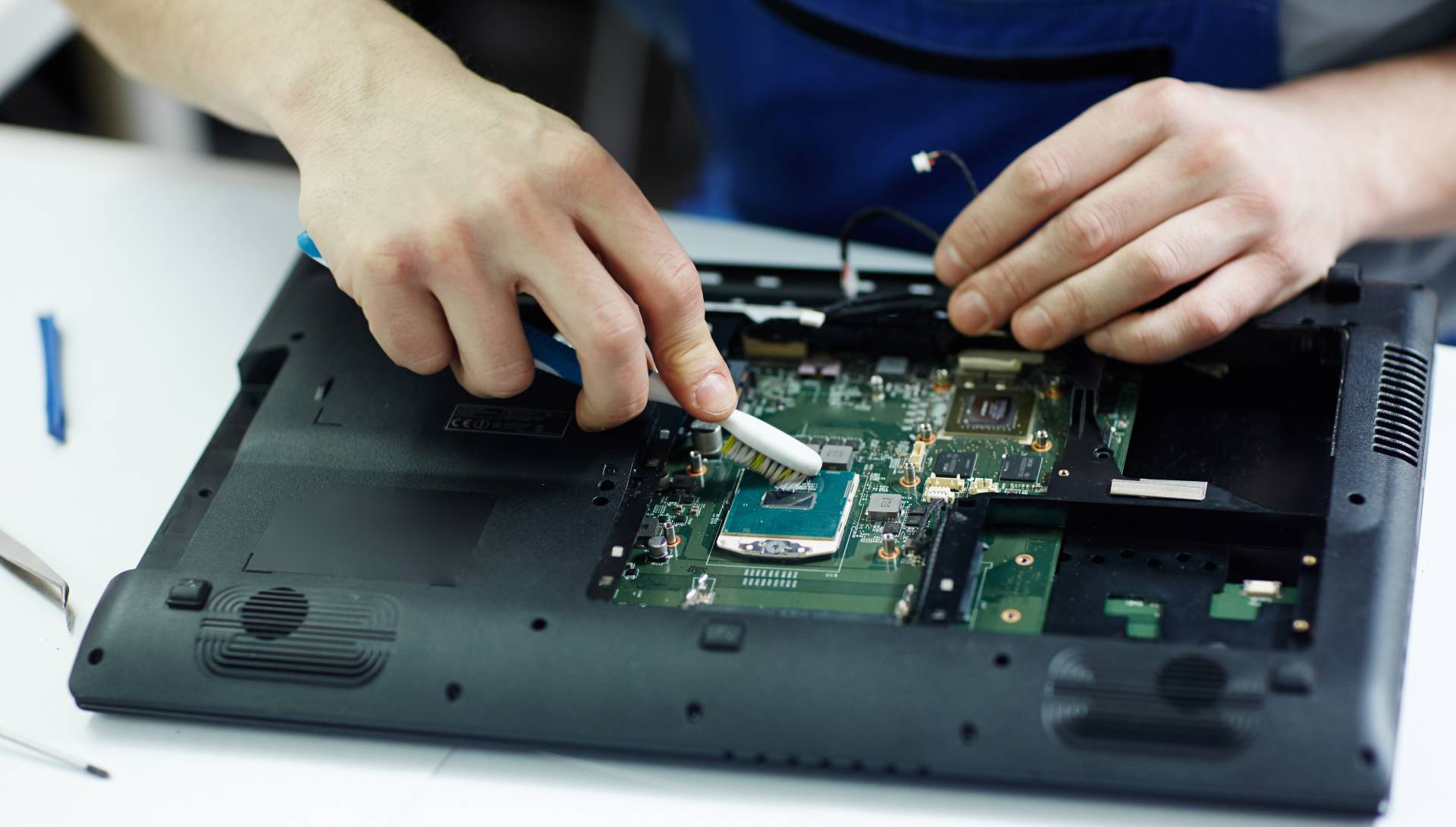 technician-clearing-circuit-board technician clearing circuit board 1